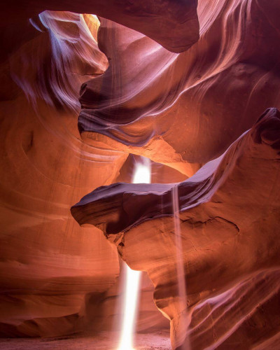 Antelope canyon lit by sunbeams